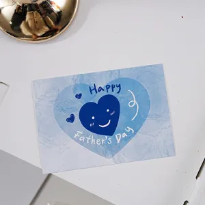 Vue détaillée d'une carte de vœux cœur bleu pour la fête des pères, idéale pour cadeaux.
