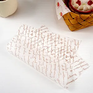 Detail view of translucent greaseproof baking paper with vintage script design for sandwiches.