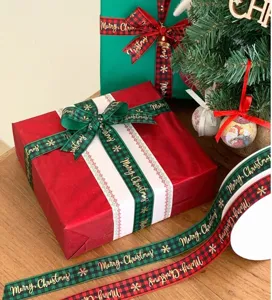 Christmas plaid ribbon with gold foil snowflakes for holiday gift wrapping and DIY crafts detail