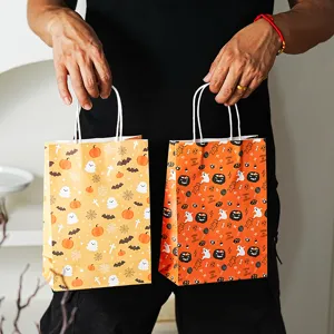 Halloween gift paper bags with pumpkin and ghost prints, perfect for party favors and treats.