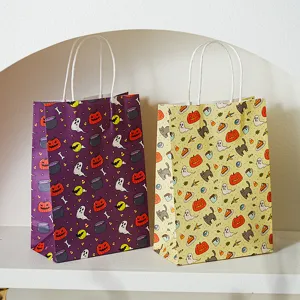 Halloween paper gift bags with handles, featuring cute pumpkin and ghost patterns for treat packaging.