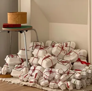 Detail view of eco-friendly pulp burger boxes and gift packaging stacked neatly for Christmas.