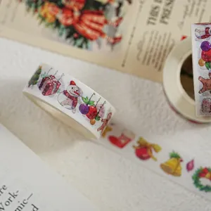 Close-up of Christmas washi tape with cute snowman and gift illustrations for crafts.