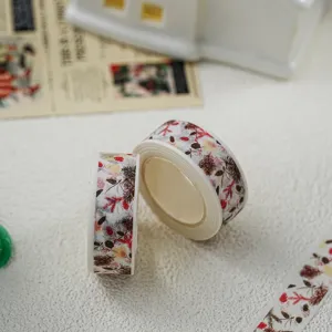 Detail view of Christmas washi tape, decorative DIY stationery masking tape with pinecone pattern.