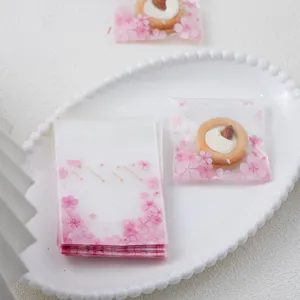 Sakura pattern frosted clear self-adhesive plastic cookie packaging bag detail view display.