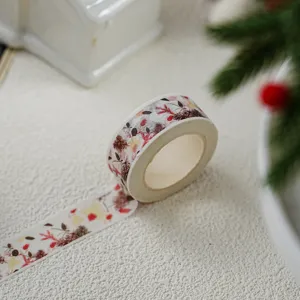 Christmas washi tape detail, decorative adhesive tape featuring pine and berry pattern for diy craft.