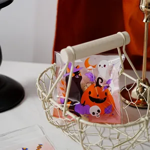 Halloween clear cookie packaging bag with cute ghost pumpkin cat print in wire basket.
