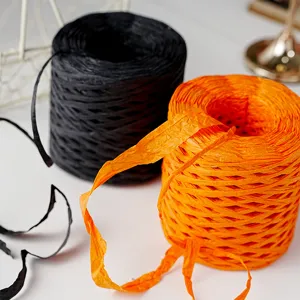 Paper twine ribbon rolls in black and orange for DIY craft, gift box wrapping and decor.