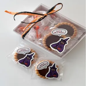 Halloween gift cookie box set with cute witch stickers and festive packaging for party favors.