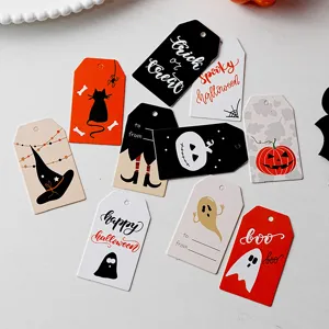 Halloween paper gift tags set with spooky cute designs for DIY party favor packaging.