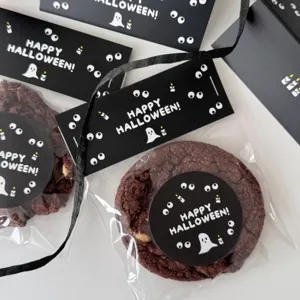 Halloween ghost cookie packaging with cute header cards and sticker labels for party treats.