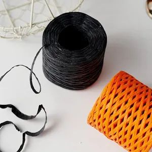 Black and orange paper twine rolls for DIY gift box packaging, decorative handmade ribbon.