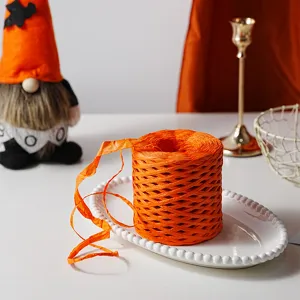 Orange paper string ribbon twine for DIY gift packaging box decoration and hand-woven craft projects.