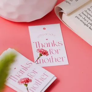 Detail view of Mother's Day gift hang tags with pink carnations and elegant lettering for bouquets.
