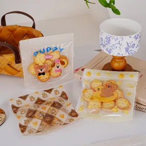 Sachets d'emballage zippés en plastique transparent pour biscuits et bonbons avec de mignons motifs.