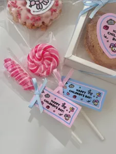 Cute children's day gift tags set with lollipops and ribbons perfect for students.