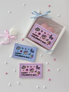 Close-up detail of cute children's day greeting card, pink and blue cartoon design for gift.