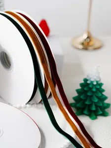 Close-up of colorful velvet ribbons for Christmas gift wrapping and holiday DIY craft decor.