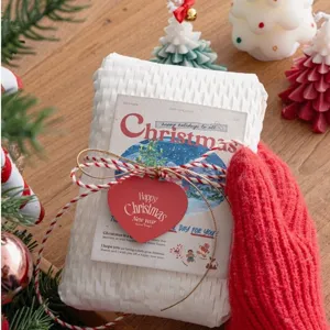 Christmas DIY gift wrapping set featuring red heart tag and festive greeting card display