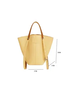 Yellow leather bucket bag detail view showing vertical height and base dimensions.