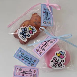 Cute cartoon children's day gift bag set with hanging tags and stickers for kids party.