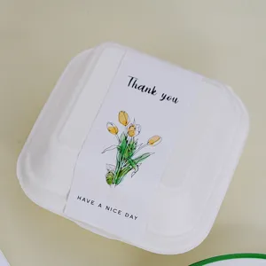 Umweltfreundliche biologisch abbaubare Lunchbox mit tulpenverzierter Banderole.