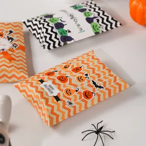Halloween pillow candy paper box detail view, festive pumpkin and bat pattern design for party.