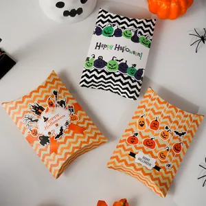 Detailed view of Halloween pillow candy paper boxes with cute pumpkin and ghost print patterns.