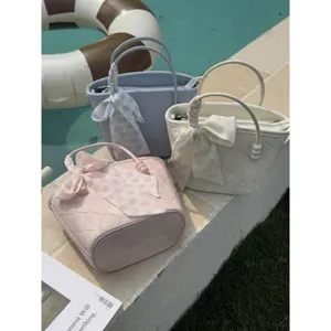 Chic quilted women handbag resort style bucket bag with elegant ribbon and pearl handle