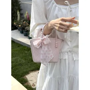 Pink quilted women handbag sweet basket bag with floral scarf handle detail, casual chic.