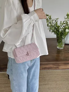 Women's pink quilted shoulder bag with chain strap and elegant chic design for daily commute.