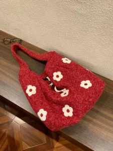 Red fuzzy floral knit tote bag for women, cute winter shoulder bag with white daisies.
