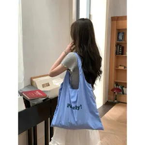 Korean style blue striped nylon tote bag with letter print, casual large capacity shoulder bag.