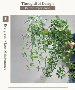 Detailed shot of artificial hanging green plants with lush leaves for home wall decor.