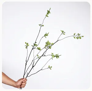 Detailed view of artificial green leaf branch, perfect for vase floral home decor.