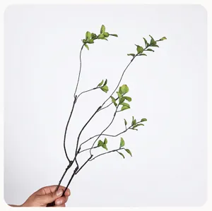 Artificial green leaf plant branch detail, perfect for vase arrangement and room decor.