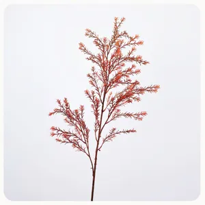 Close-up detail of artificial reddish-brown pine needle branch, perfect for floral arrangement.