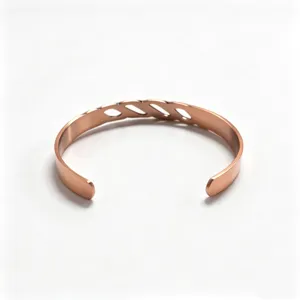 Copper magnetic cuff bracelet detail showing the elegant open weave infinity design clearly.