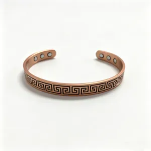 Copper magnetic bracelet detail shot showing Greek key pattern and inner strong magnets.