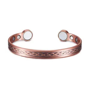 Retro copper magnetic open cuff bracelet with vintage celtic knot pattern and magnetic ends.