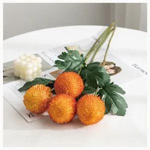 Artificial orange pompon chrysanthemum flowers for home wedding decoration floral arrangement.
