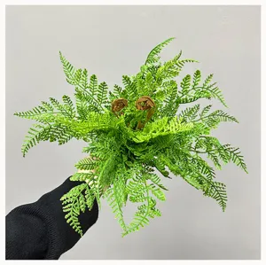 Detailed close-up of artificial fern leaves, lush green artificial plant foliage decoration.