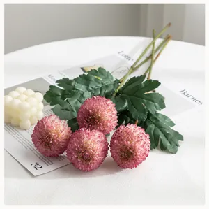Artificial pink pompon chrysanthemum flower bouquet detail for home decor and wedding arrangement.
