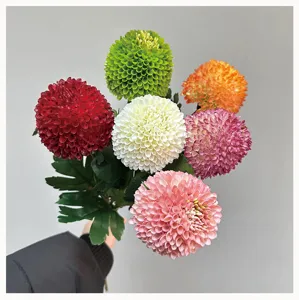 Artificial pompon chrysanthemum flower bouquet detail, multi-color decorative floral arrangement.