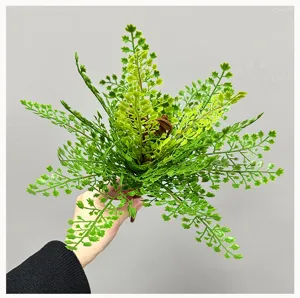 Close-up of artificial fern leaves showing detailed texture, ideal for plant walls and decor.