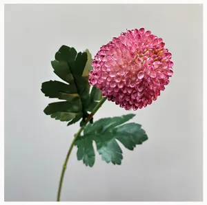 Artificial pompon chrysanthemum flower detail view, pink stem floral decoration for home decor.