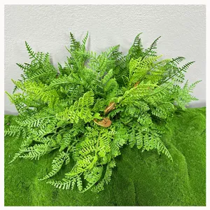 Artificial fern leaves detail shot, lush green fake plant for wall decor and floral arrangements.