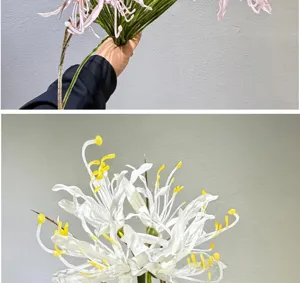Artificial silk spider lily flower close-up detail, white fake floral decor stamen.
