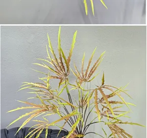 Détail de branche de feuille d'érable artificielle, feuillage réaliste pour décoration.