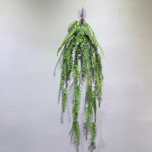Artificial hanging fern plant green vine wall decor for restaurant and home decoration.